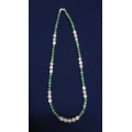 Stringed necklace made of green onyx, rose quartz and silver rings